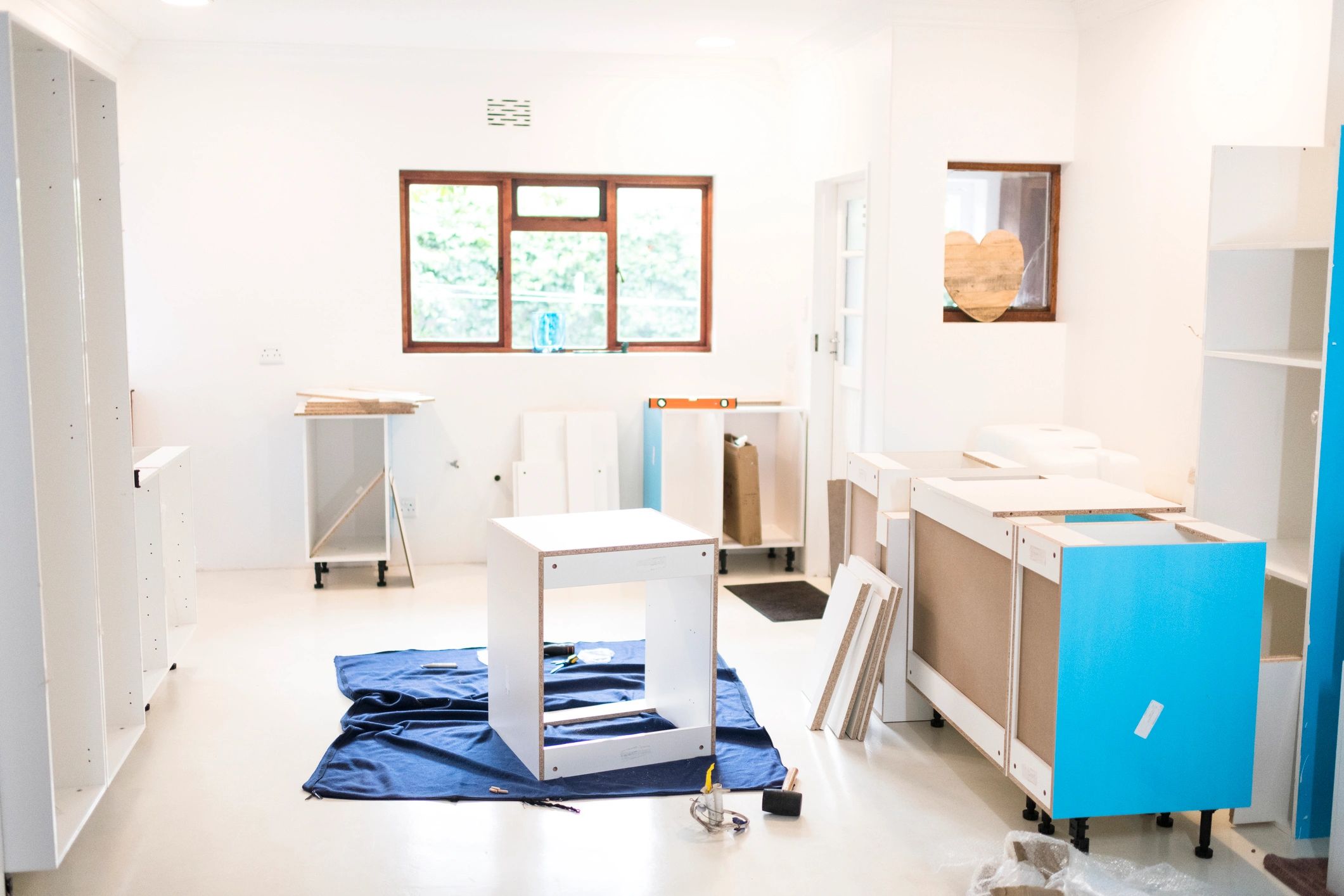Cabinets being assembled in a modern interior project