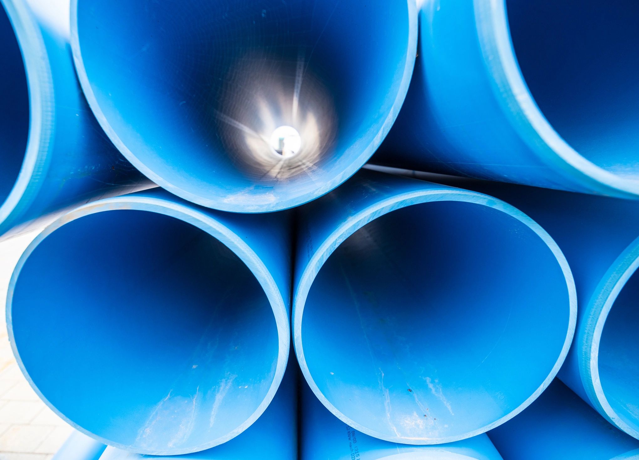 Blue plastic pipes prepared for industrial supply