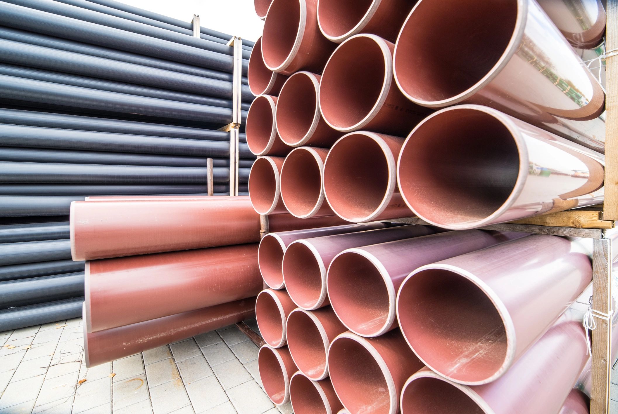 Stacks of plastic pipes for industrial manufacturing