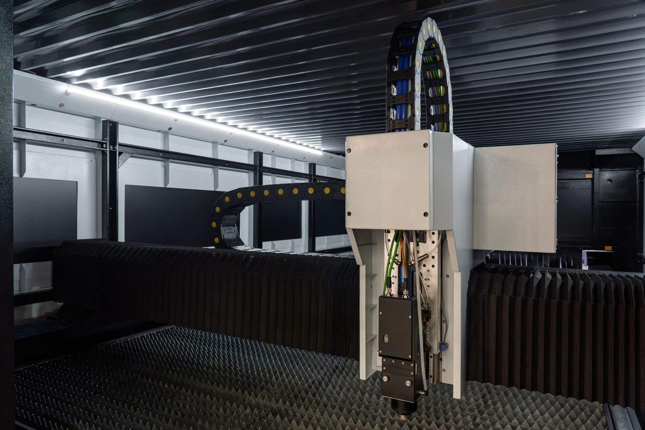 CNC fiber laser cutting machine in a metal manufacturing facility